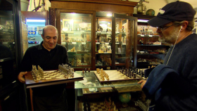 Imad Khachan shows a customer chess set. Sets range from $10 to $10,000. Photo credit: Russ Marhull